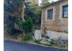 Plot of land with small stone house