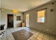 For sale Two-level village house with storage room and land in the characteristic medieval hamlet of
