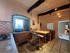 For sale Two-level village house with storage room and land in the characteristic medieval hamlet of