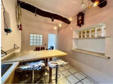 For sale Two-level village house with storage room and land in the characteristic medieval hamlet of