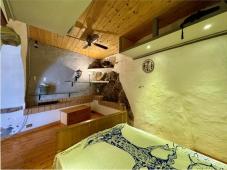 For sale Two-level village house with storage room and land in the characteristic medieval hamlet of