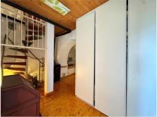 For sale Two-level village house with storage room and land in the characteristic medieval hamlet of