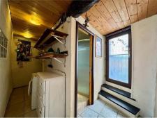 For sale Two-level village house with storage room and land in the characteristic medieval hamlet of