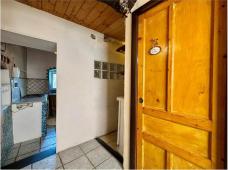 For sale Two-level village house with storage room and land in the characteristic medieval hamlet of